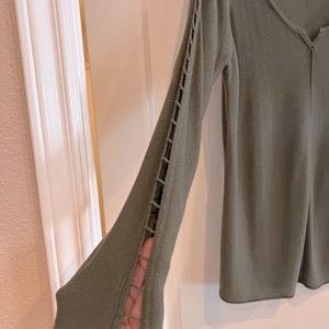 Venus light sweater top with open detail on sleeves.